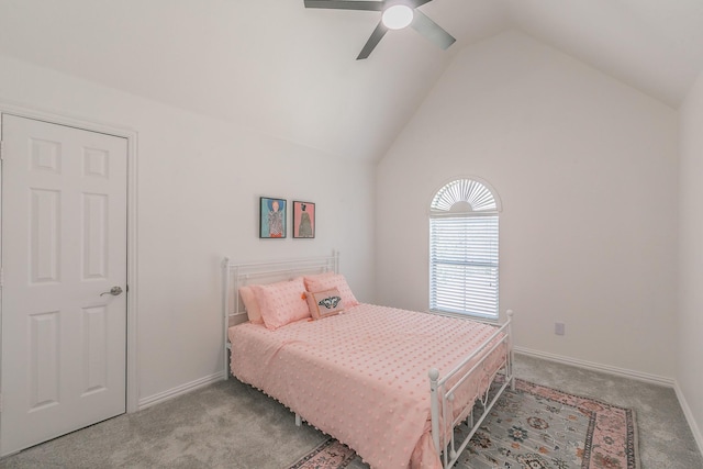 bedroom with ceiling fan, light colored carpet, and vaulted ceiling