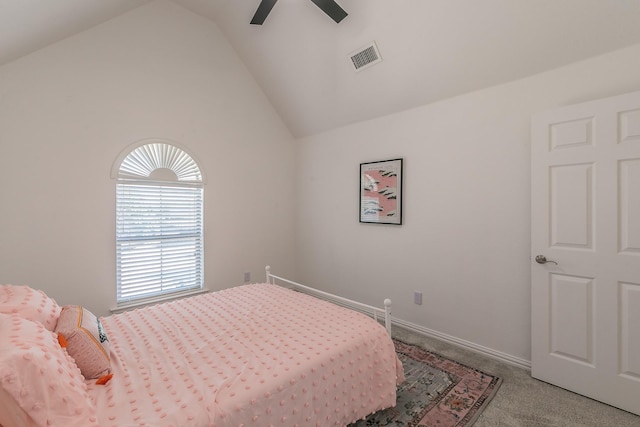 carpeted bedroom featuring vaulted ceiling and ceiling fan