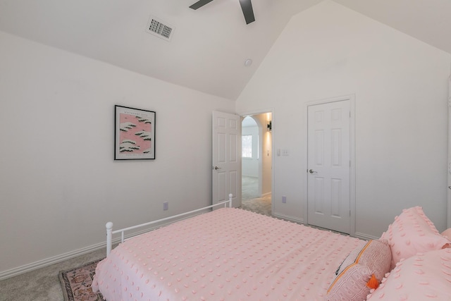 carpeted bedroom featuring ceiling fan and high vaulted ceiling