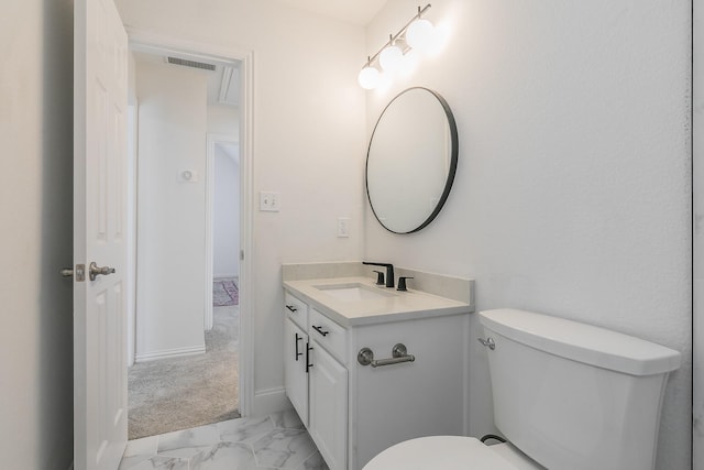 bathroom with vanity and toilet