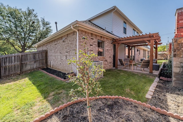 back of house featuring cooling unit, a pergola, a patio area, and a lawn