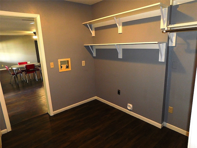 laundry room with hookup for a washing machine, dark hardwood / wood-style flooring, and electric dryer hookup