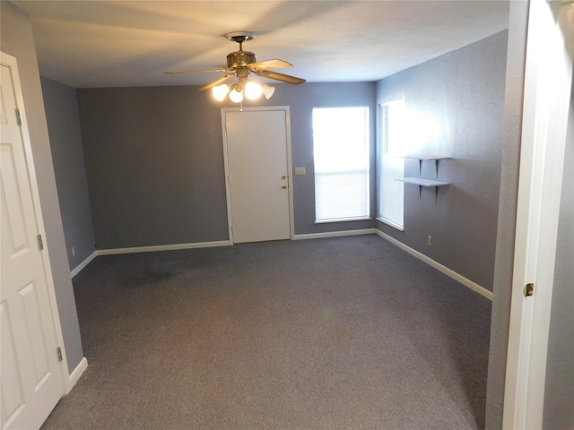 carpeted empty room featuring ceiling fan