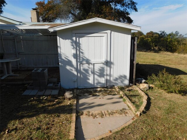 view of outbuilding featuring a yard