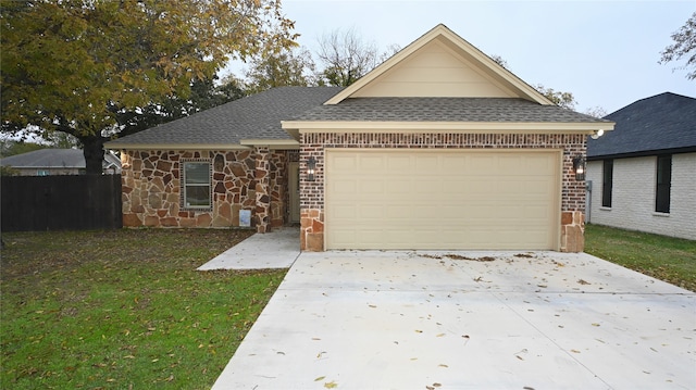 single story home featuring a garage and a front lawn