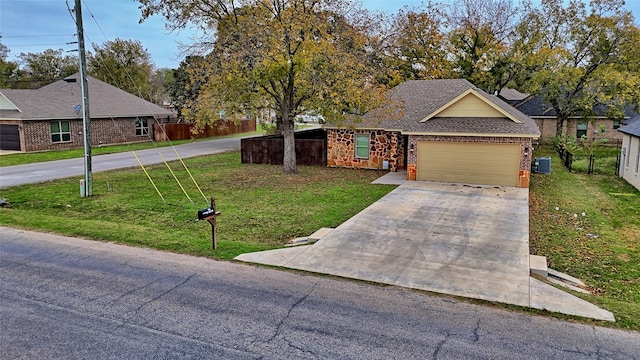 ranch-style house with central AC unit, a front lawn, and a garage