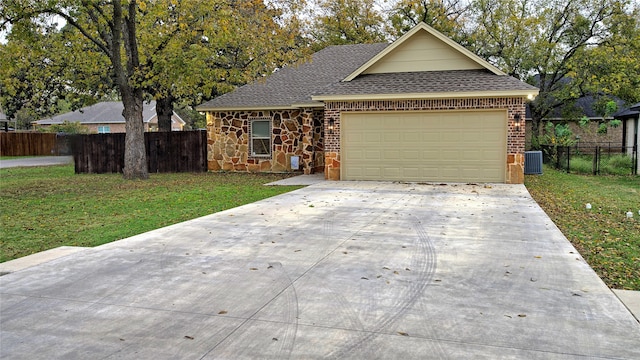 single story home with a front yard, a garage, and cooling unit