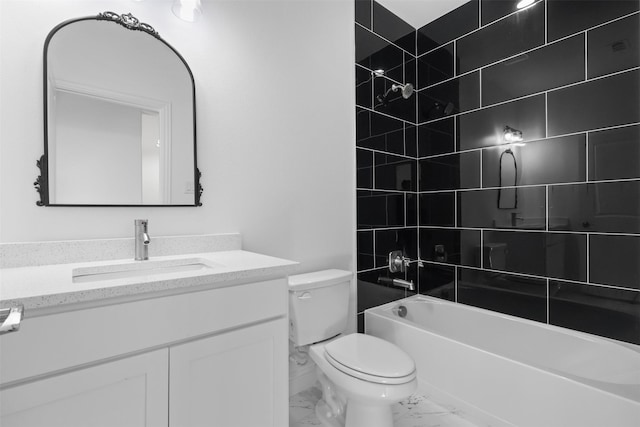 full bathroom with vanity, tiled shower / bath combo, and toilet