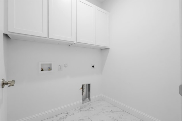 laundry area featuring hookup for an electric dryer, gas dryer hookup, cabinets, and hookup for a washing machine