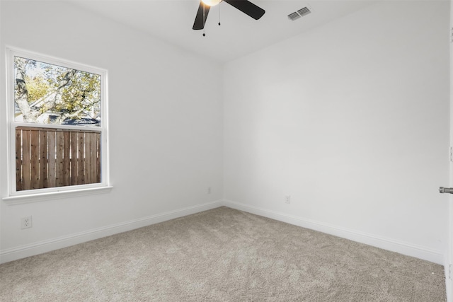 empty room with carpet floors and ceiling fan