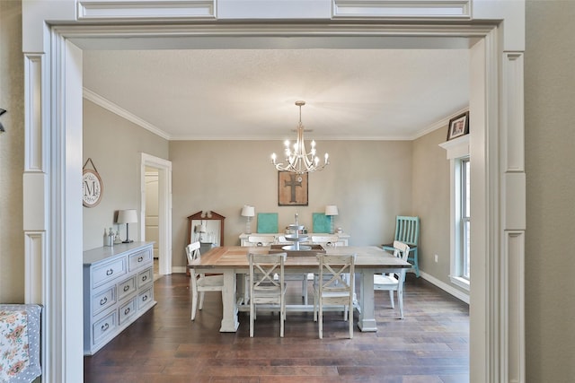 dining room with ornamental molding, dark wood-type flooring, and an inviting chandelier