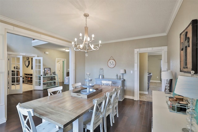 118 Prairie Creek Way, Abilene, TX 79602 - dining room with a chandelier, crown molding, dark wood-style flooring, baseboards, and french doors