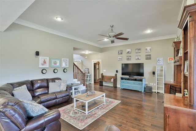 living room with ceiling fan, dark hardwood / wood-style floors, and ornamental molding