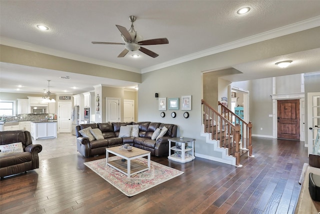 118 Prairie Creek Way, Abilene, TX 79602 - living area featuring a ceiling fan, wood finished floors, stairway, crown molding, and baseboards