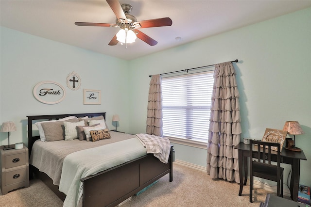 bedroom with ceiling fan and light colored carpet