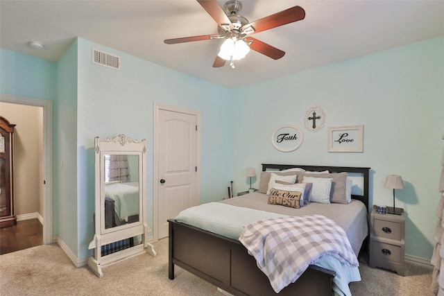 carpeted bedroom featuring ceiling fan