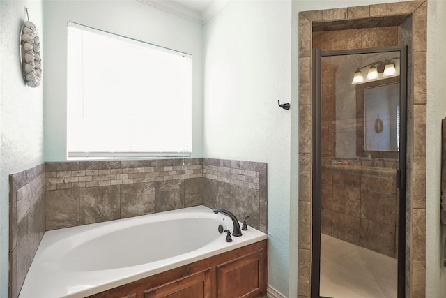 bathroom featuring crown molding and plus walk in shower