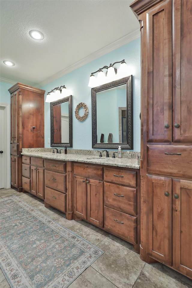 118 Prairie Creek Way, Abilene, TX 79602 - bathroom with crown molding, double vanity, recessed lighting, and a textured ceiling