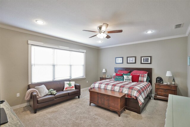 carpeted bedroom with ceiling fan and ornamental molding