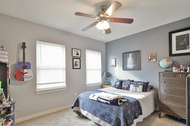 bedroom featuring ceiling fan and carpet