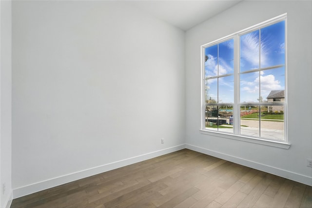 823 Shady Oaks Dr, Rockwall, TX 75087 - spare room featuring baseboards and dark wood-style floors