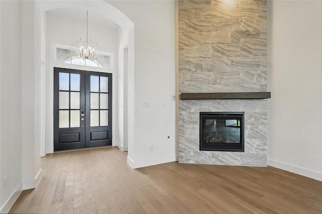 823 Shady Oaks Dr, Rockwall, TX 75087 - entrance foyer with a chandelier, french doors, wood finished floors, and baseboards
