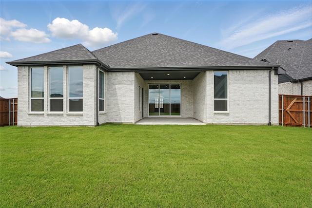 823 Shady Oaks Dr, Rockwall, TX 75087 - rear view of house with roof with shingles, a patio area, and brick siding