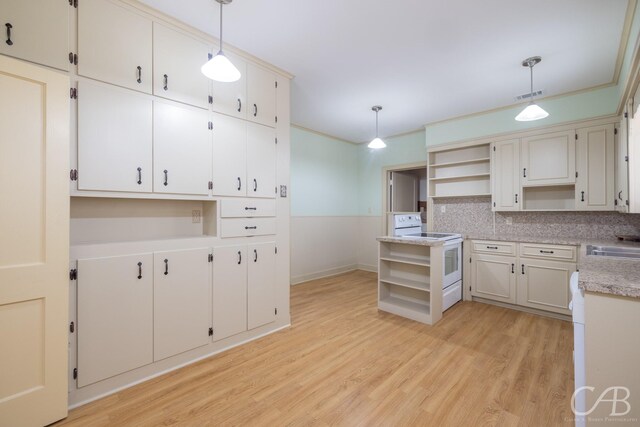 kitchen with white range with electric stovetop, light hardwood / wood-style floors, and decorative light fixtures