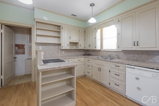 kitchen with dishwasher, backsplash, decorative light fixtures, and light hardwood / wood-style flooring