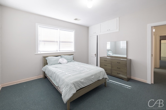 bedroom with dark carpet