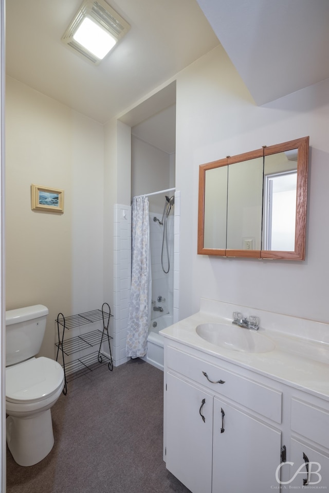 full bathroom with vanity, shower / tub combo, and toilet