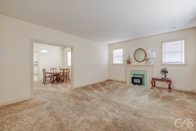 unfurnished living room featuring carpet flooring