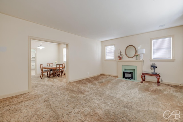 unfurnished living room featuring carpet flooring