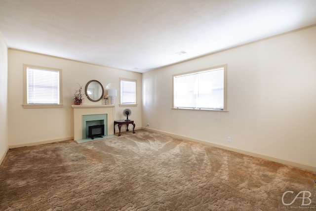 unfurnished living room with carpet