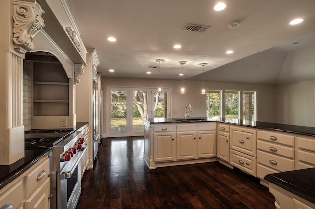 2516 Beefeater Dr, Wichita Falls, TX 76308 - kitchen featuring high end stainless steel range, dark countertops, recessed lighting, and dark wood finished floors