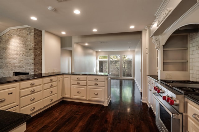 2516 Beefeater Dr, Wichita Falls, TX 76308 - kitchen featuring double oven range, dark wood-type flooring, backsplash, recessed lighting, and white cabinets