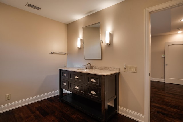 2516 Beefeater Dr, Wichita Falls, TX 76308 - bathroom featuring wood finished floors and vanity
