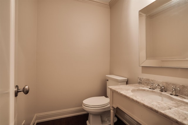 2516 Beefeater Dr, Wichita Falls, TX 76308 - half bath featuring crown molding, vanity, and wood finished floors