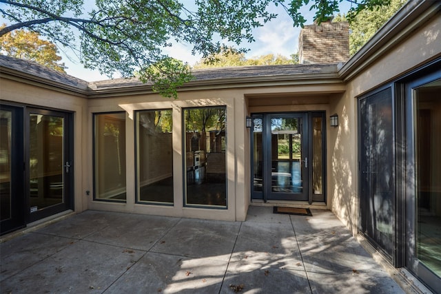 2516 Beefeater Dr, Wichita Falls, TX 76308 - property entrance with a patio, a chimney, and stucco siding
