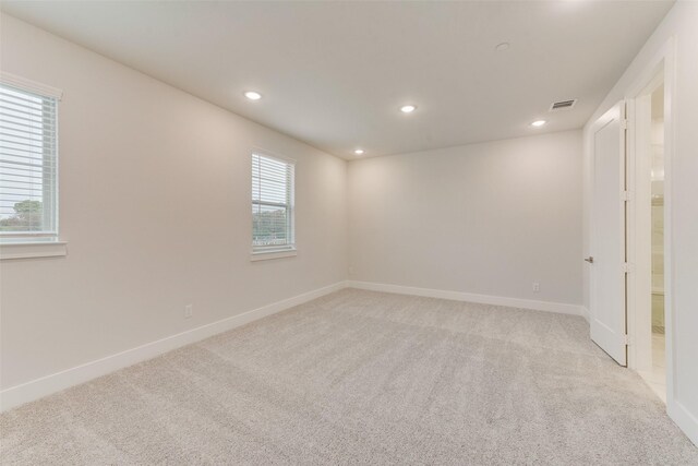 empty room featuring light colored carpet