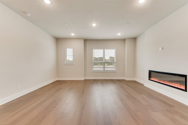 unfurnished living room featuring light hardwood / wood-style floors