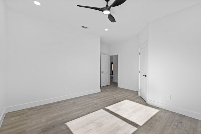 unfurnished room featuring ceiling fan and light wood-type flooring