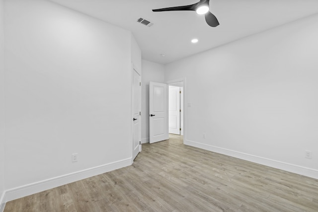 unfurnished bedroom with ceiling fan and light wood-type flooring