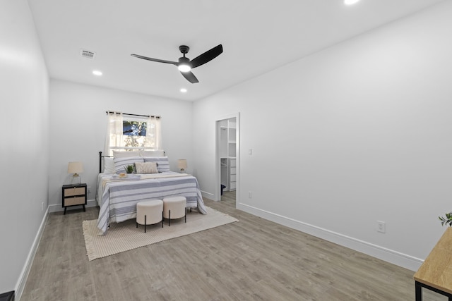 bedroom featuring ceiling fan and light hardwood / wood-style floors