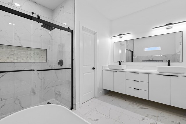 bathroom with vanity and separate shower and tub