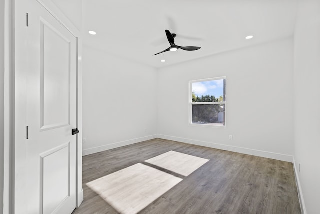 unfurnished bedroom featuring hardwood / wood-style flooring and ceiling fan