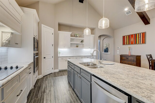 kitchen with appliances with stainless steel finishes, gray cabinetry, sink, pendant lighting, and white cabinets