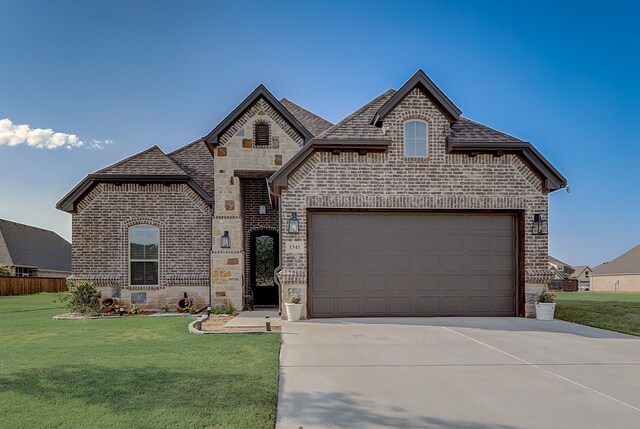 french country style house with a front lawn