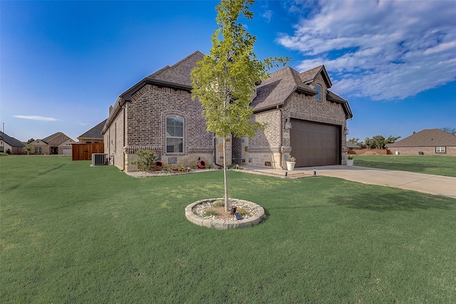 view of front of home with central AC and a front lawn