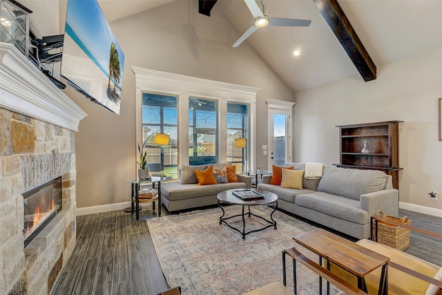 living room with ceiling fan, a fireplace, beamed ceiling, and hardwood / wood-style floors